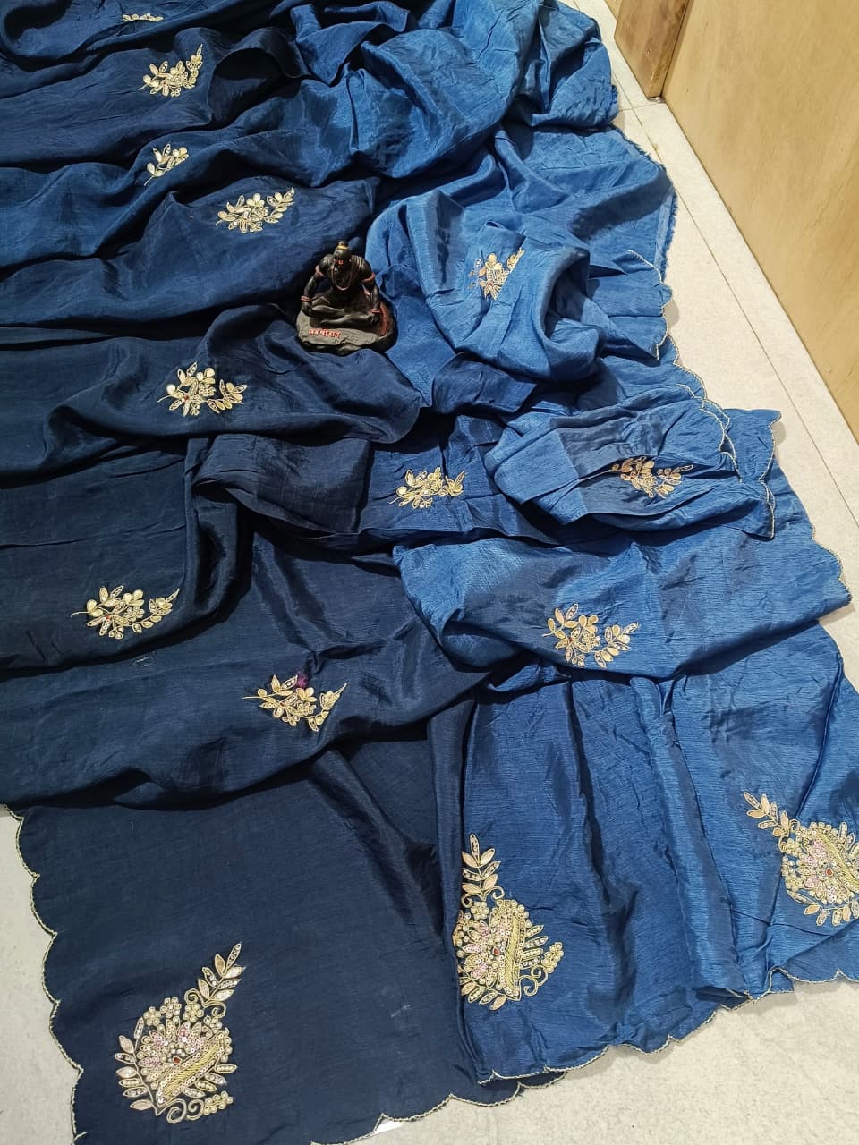 Lightweight organza paired with intricate hand embroidery