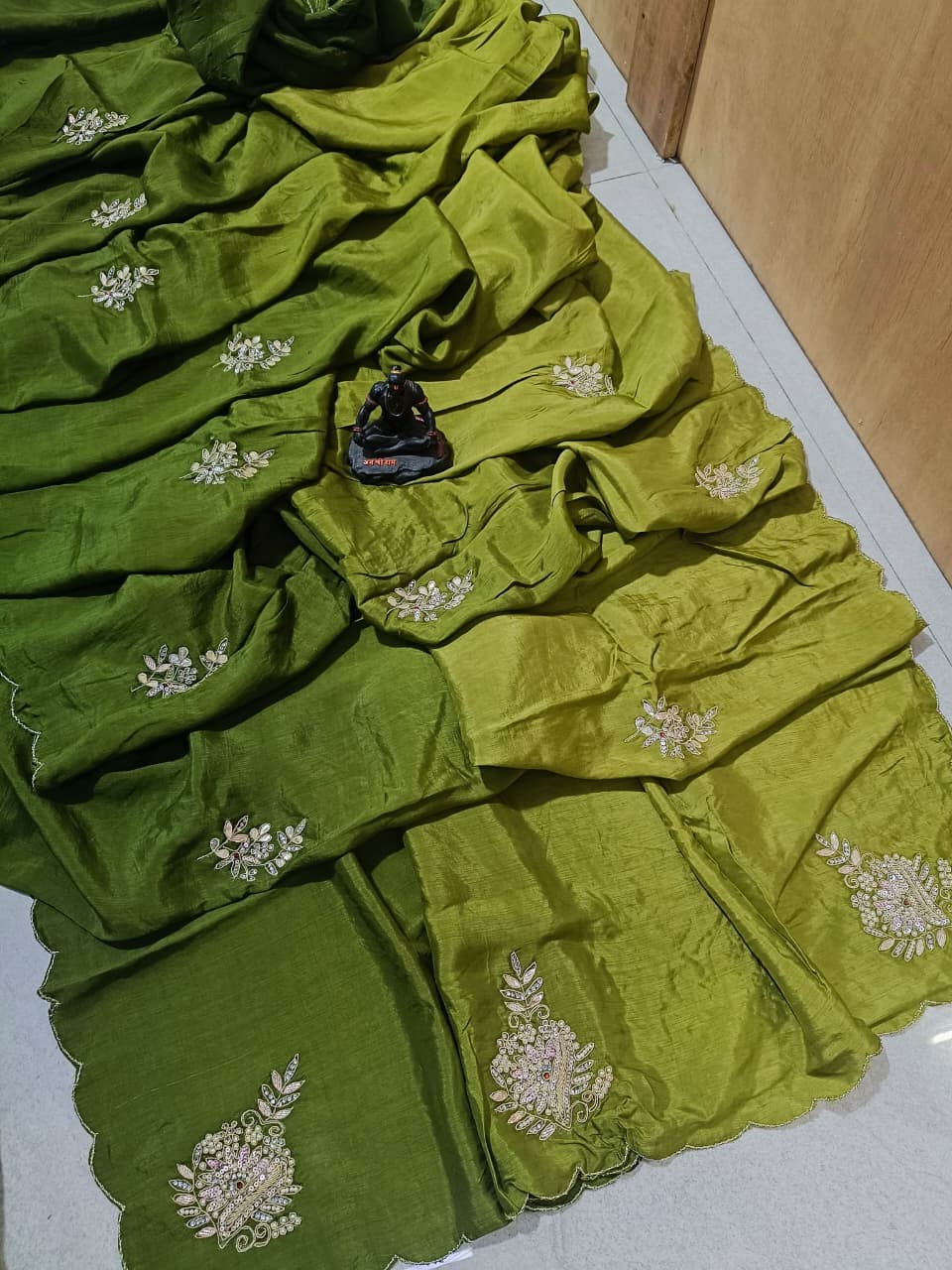 Lightweight organza paired with intricate hand embroidery