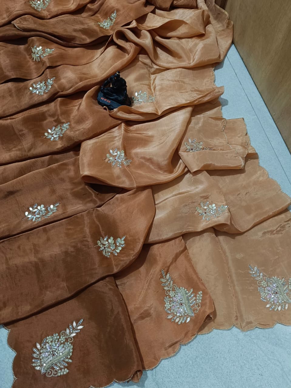 Lightweight organza paired with intricate hand embroidery