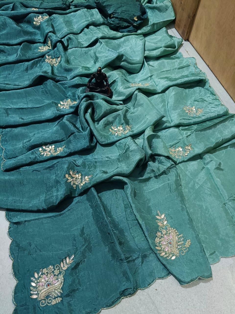 Lightweight organza paired with intricate hand embroidery