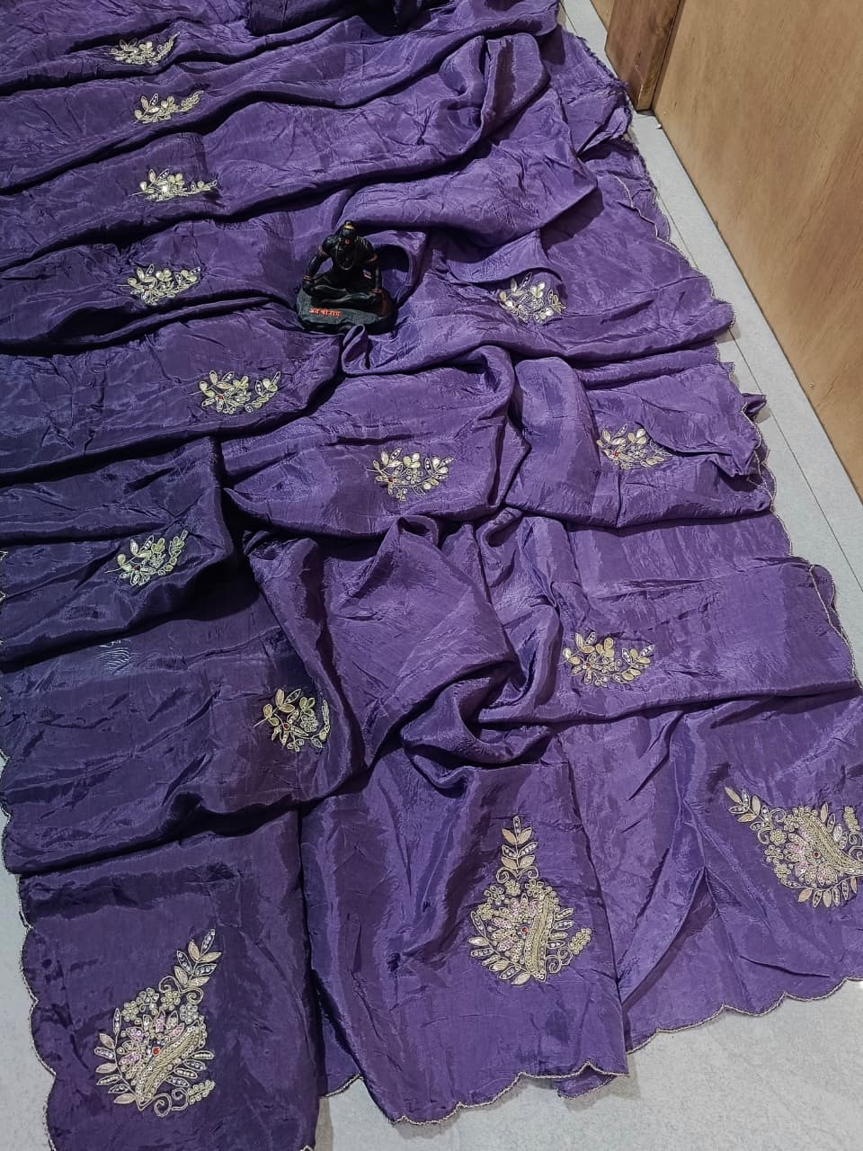 Lightweight organza paired with intricate hand embroidery